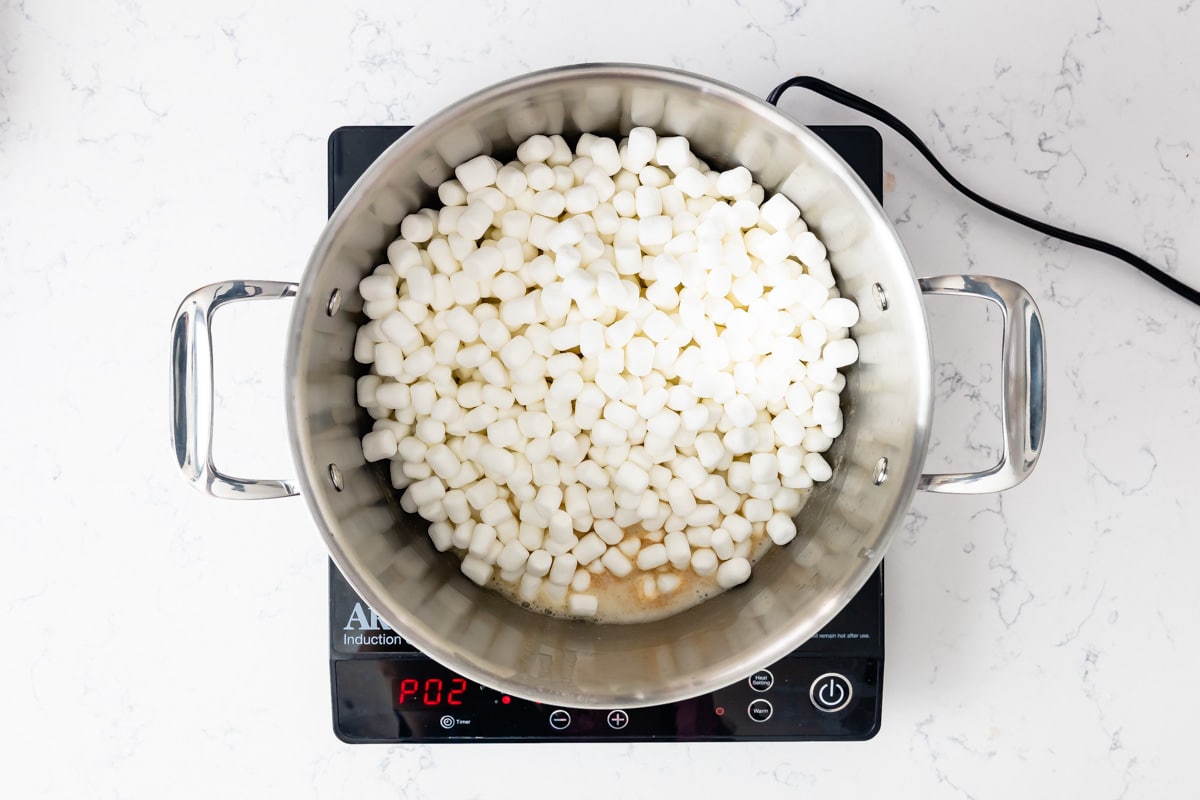 pot with melted butter and mini marshmallows.