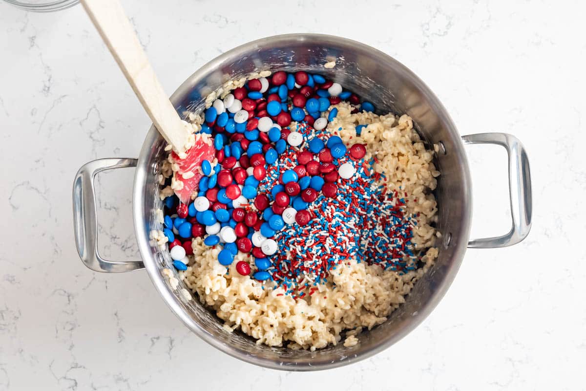 pot with rice krispie treats M&Ms and sprinkles.