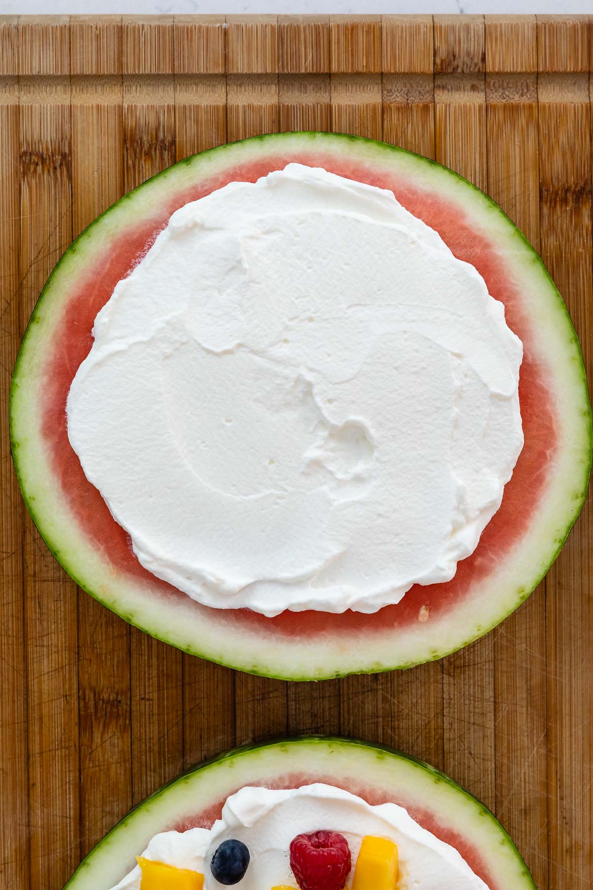 slice of watermelon with whipped cream