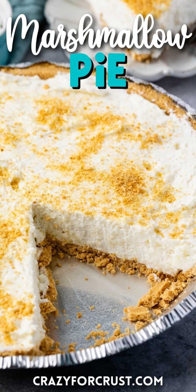 Marshmallow pie with one slice missing and recipe title on top of image