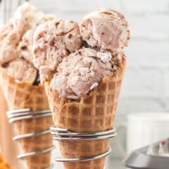 three scoops of ice cream in an ice cream waffle cone