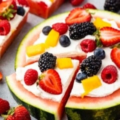watermelon pizza on grey board with berries around