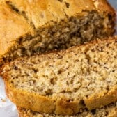 sliced banana bread with stack of 3 slices with words on photo