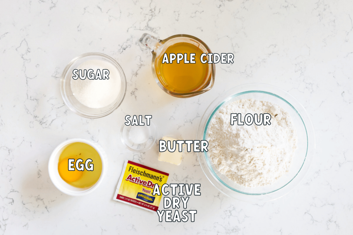 Ingredients in cinnamon roll dough: egg sugar salt apple cider butter flour yeast