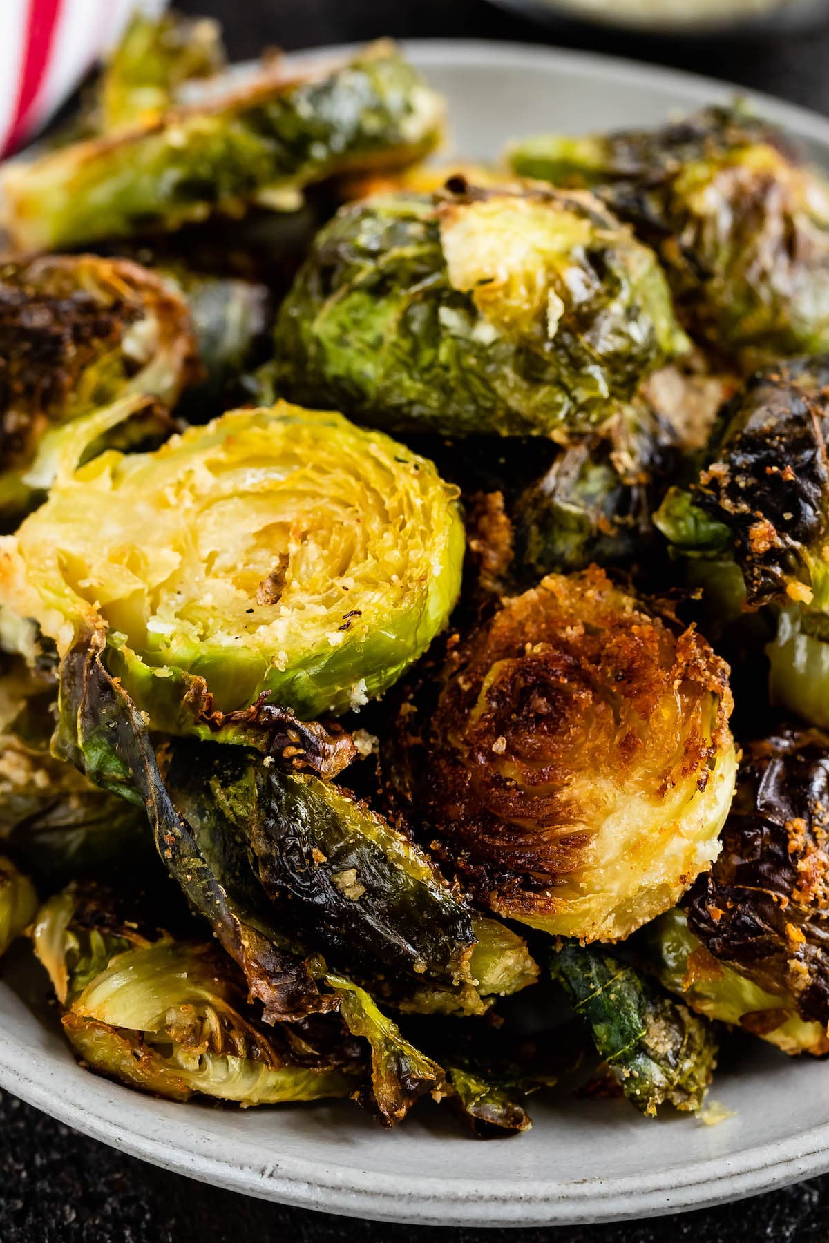Brussels sprouts sitting on a grey plate