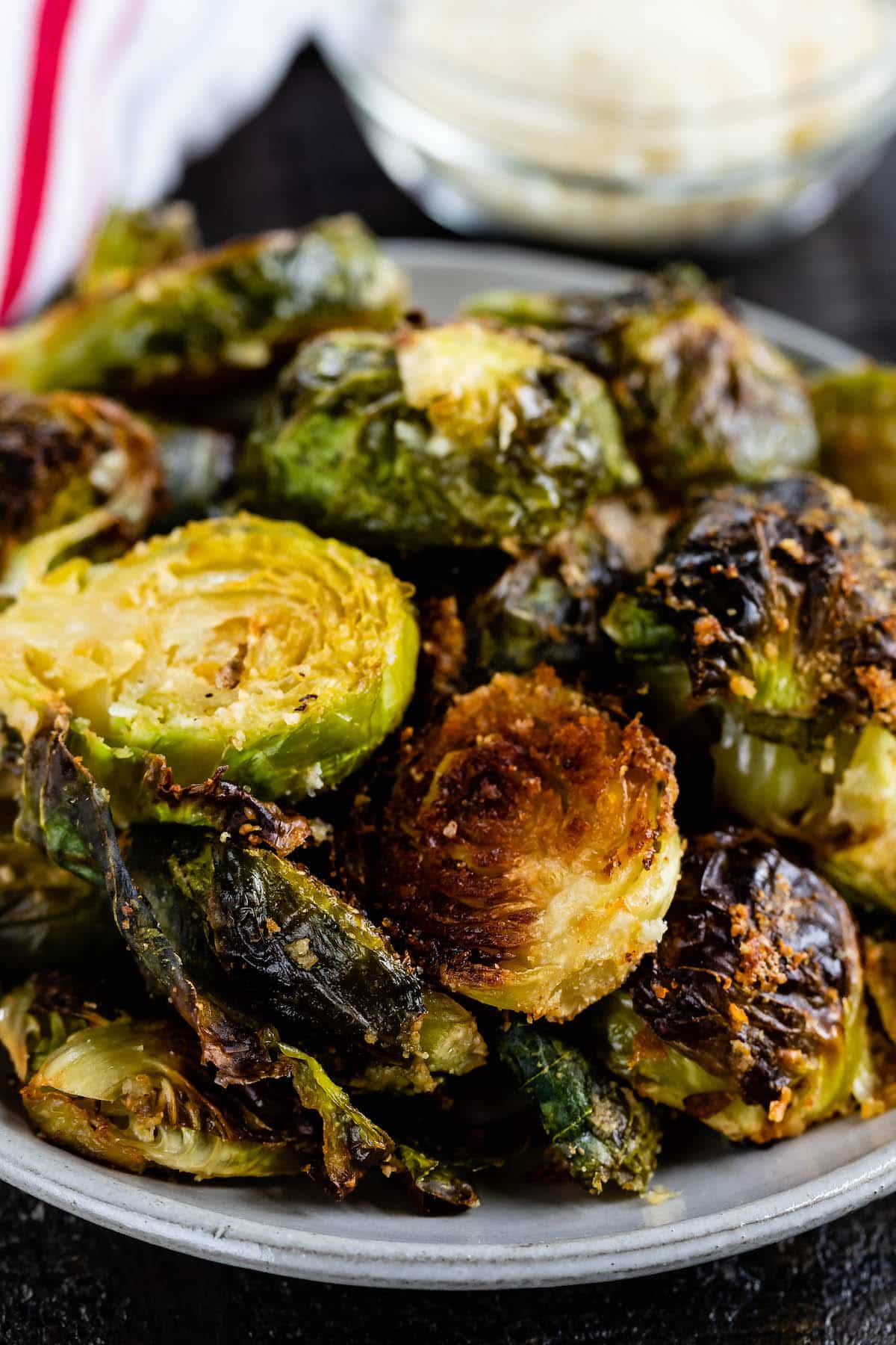 Brussels sprouts sitting on a grey plate