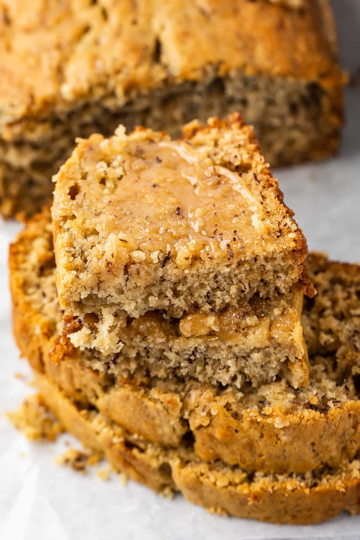 banana bread stack, with halves on top with caramel spread