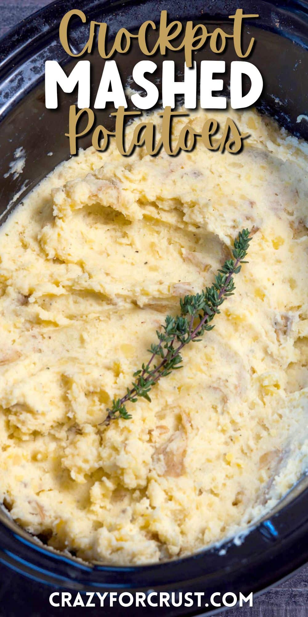 mashed potatoes in a black crockpot pan and herbs on top with words saying the name of the recipe