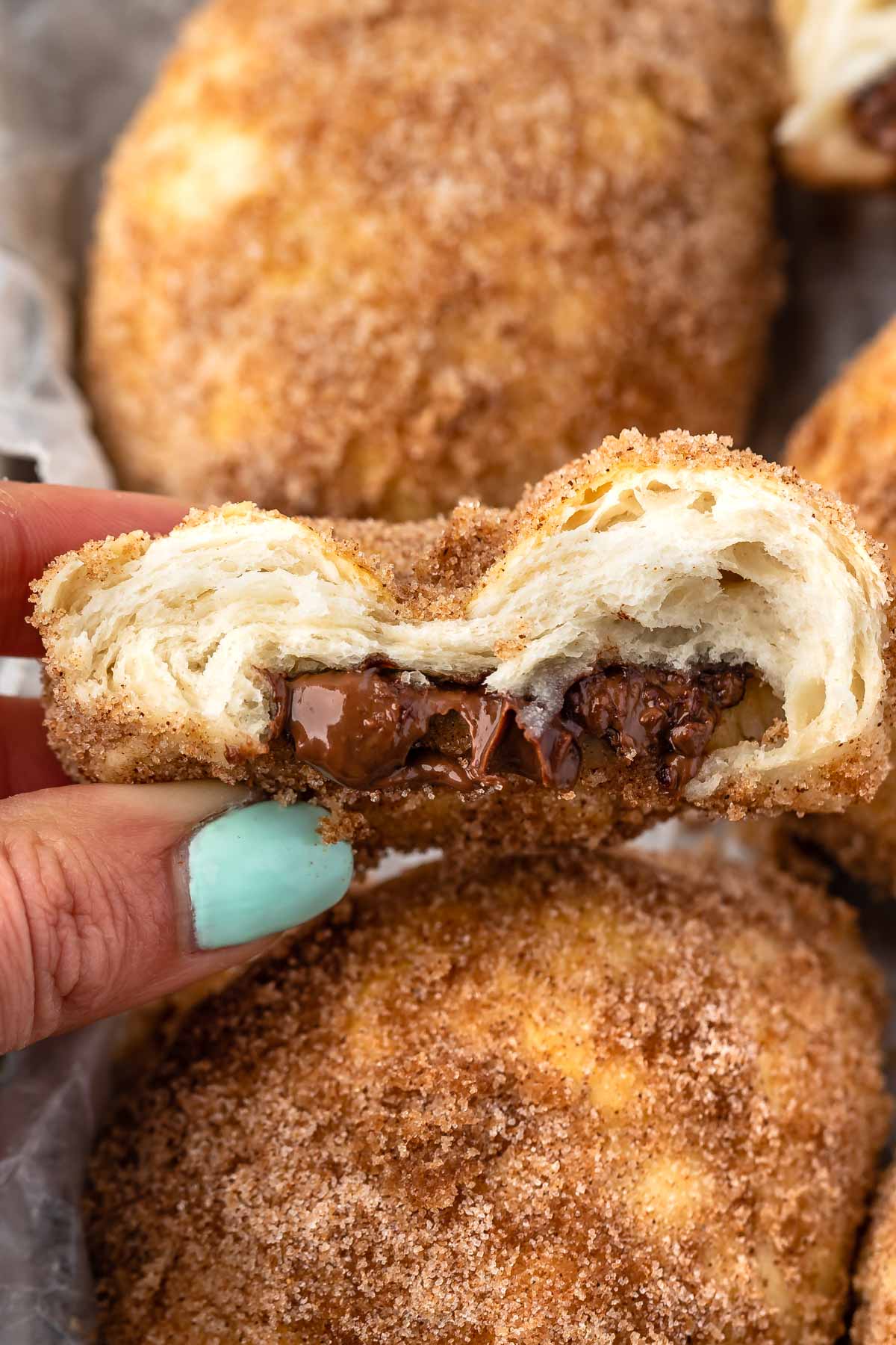 biscuit cut in half with nutella coming out of the center