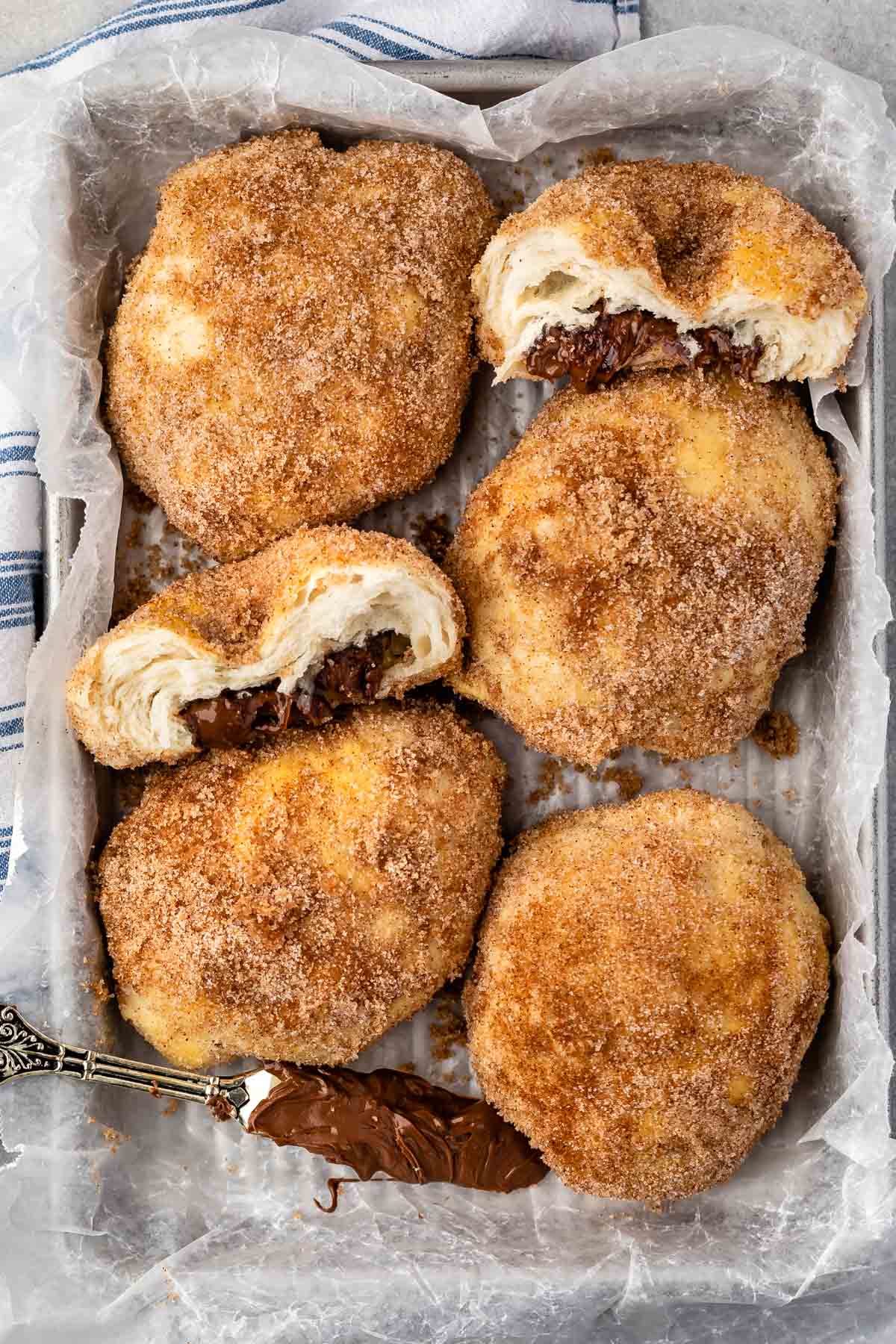 full and halved biscuits with nutella inside