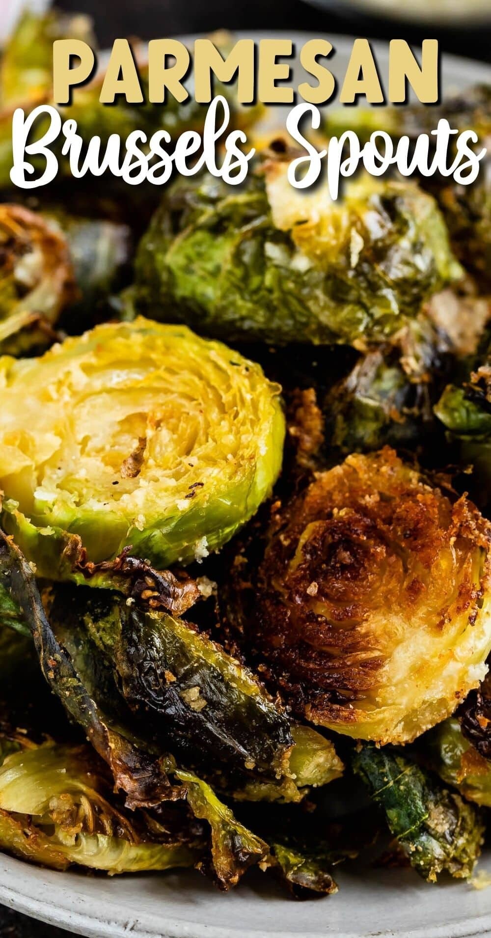 Brussels sprouts sitting on a grey plate with words on the photo