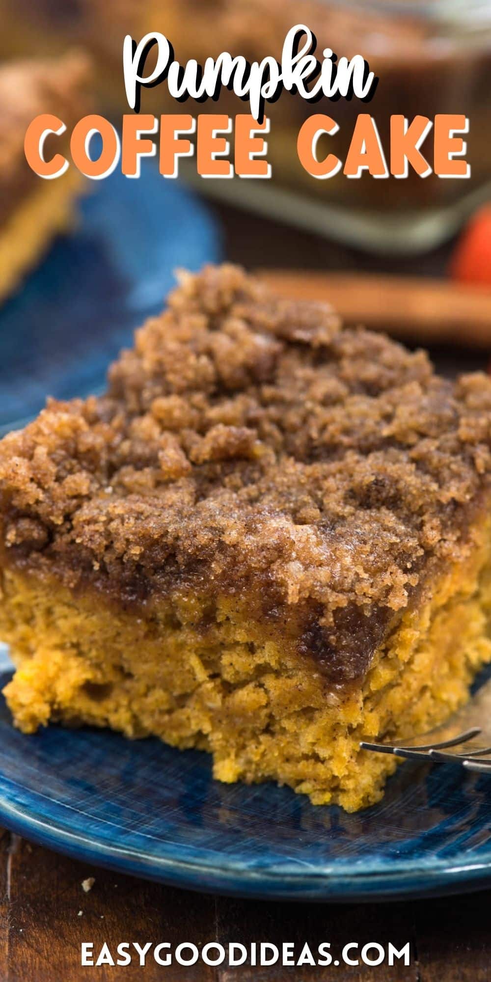 coffee cake on a dark blue plate next to a fork with words on the photo