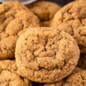 golden brown cookies stacked on each other