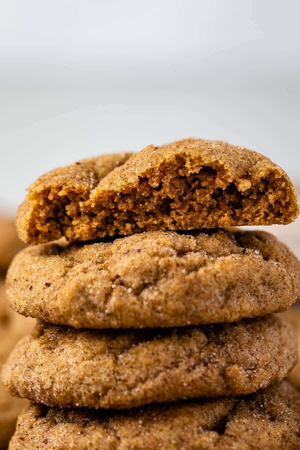 cookies stacked with the one on top cut in half