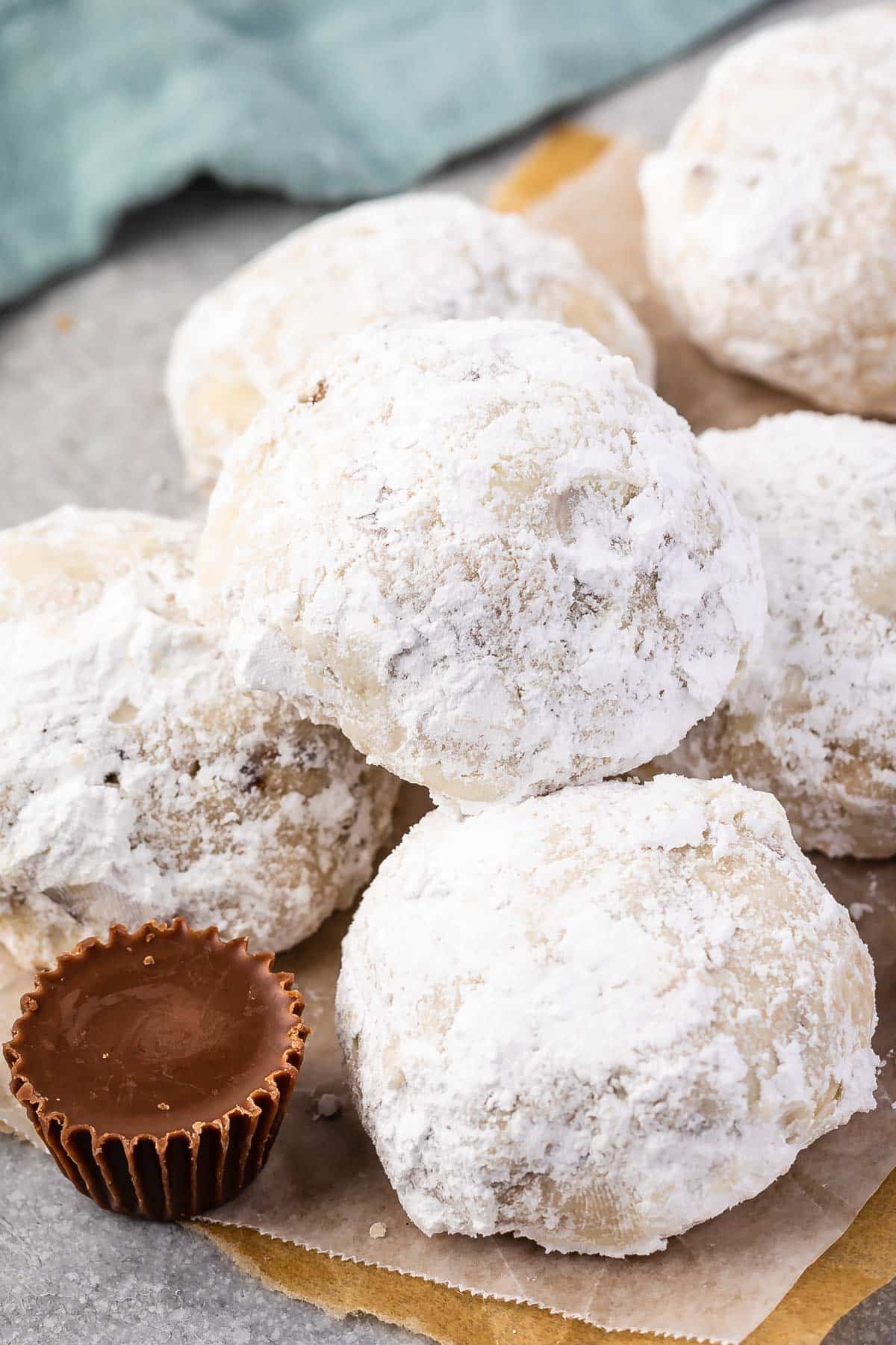 full snowball stacked on other snowballs covered in powdered sugar