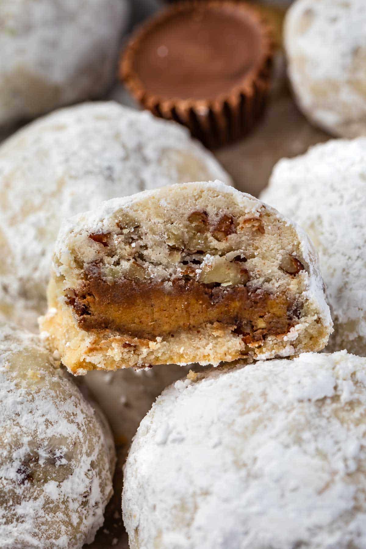 snowball cut in half revealing the peanut butter cup inside