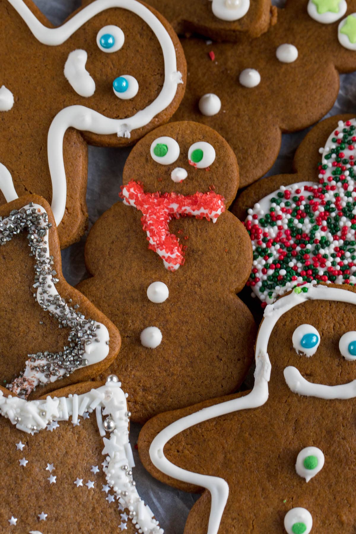 gingerbread snowman and men with outlined royal icing and sprinkles