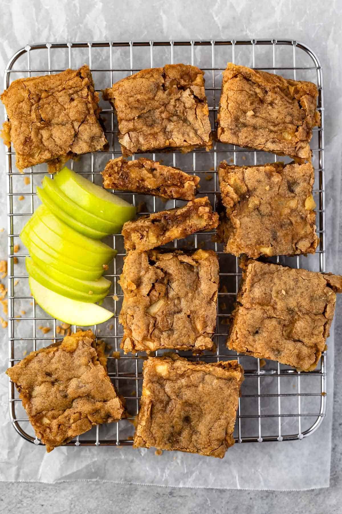 bars laying out on a drying rack next to sliced apples