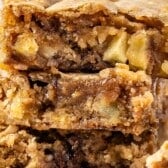 stacked toffee bars on a drying rack with apples baked in and words on top of the image