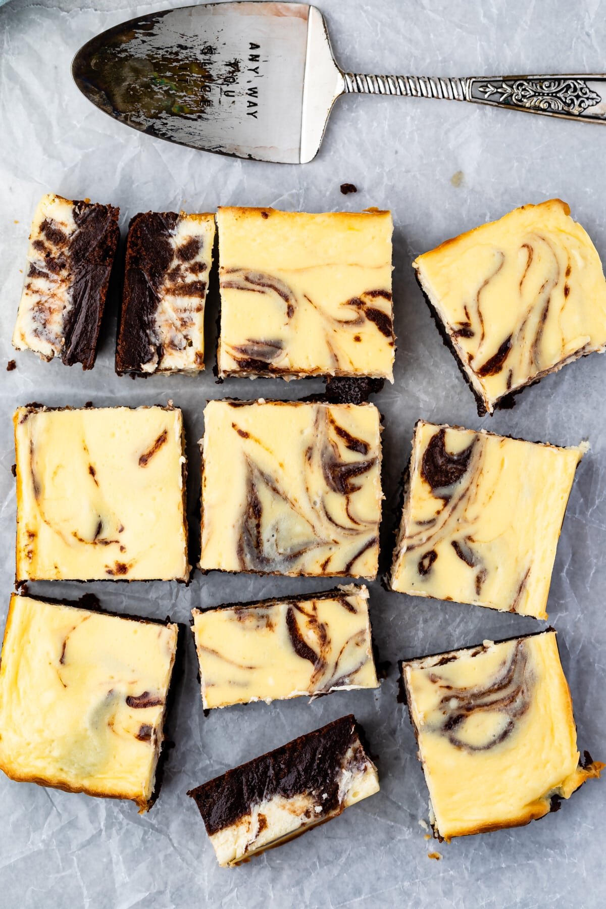 overhead shot of brownies with a layer of cheesecake on top