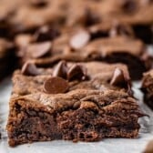 chocolate chip cookie bar on a piece of parchment paper