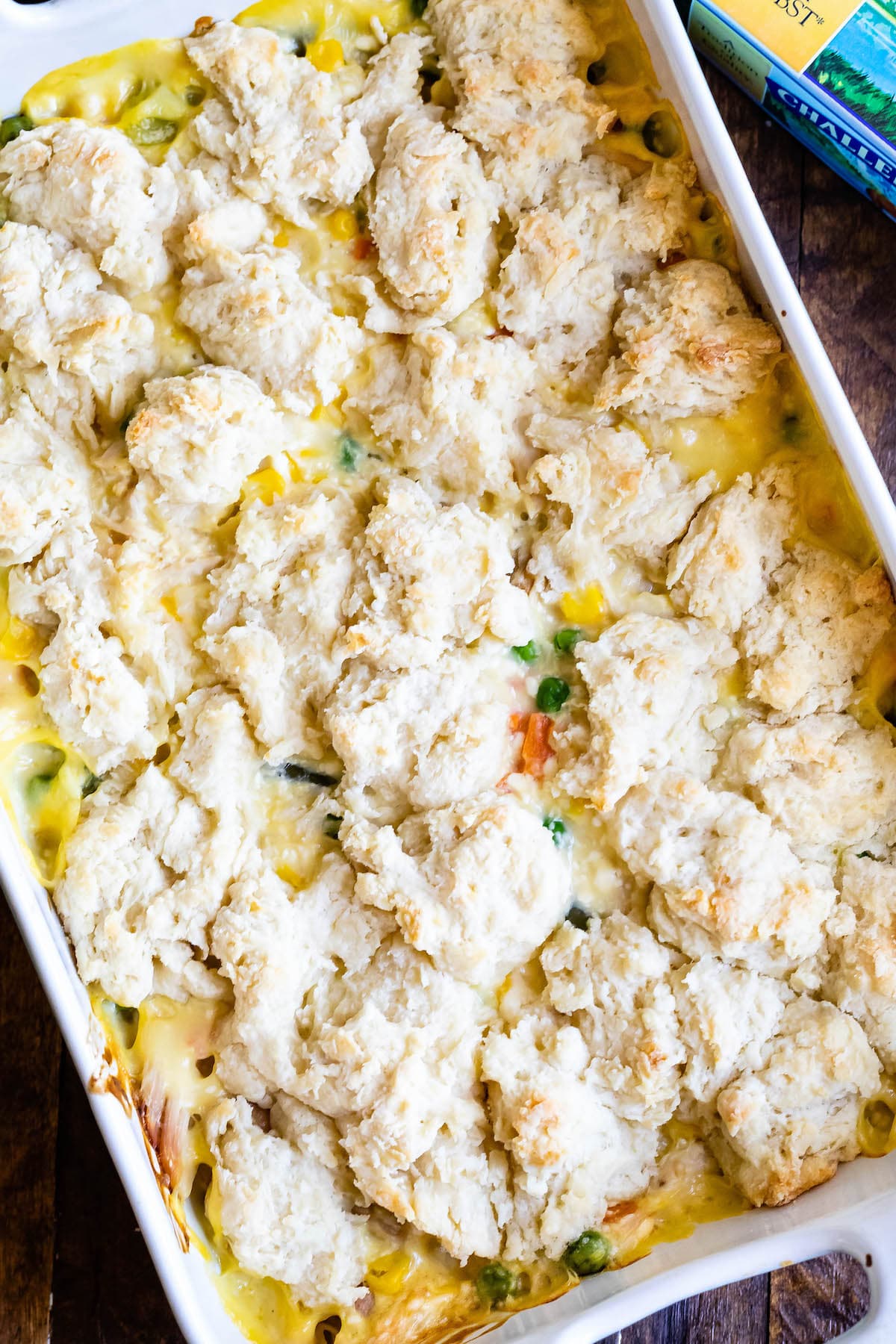 chicken and biscuits cooked together in a white pan