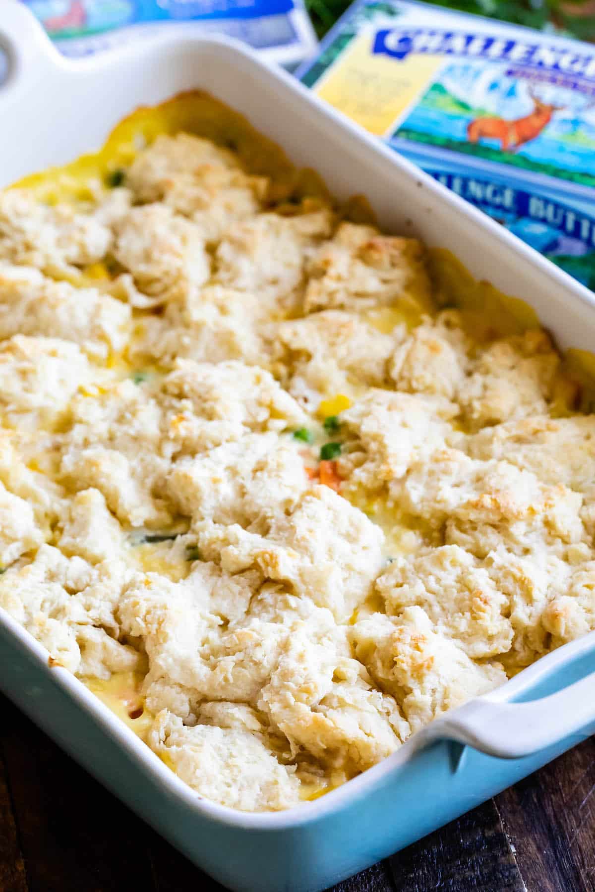 chicken and biscuits cooked together in a white pan