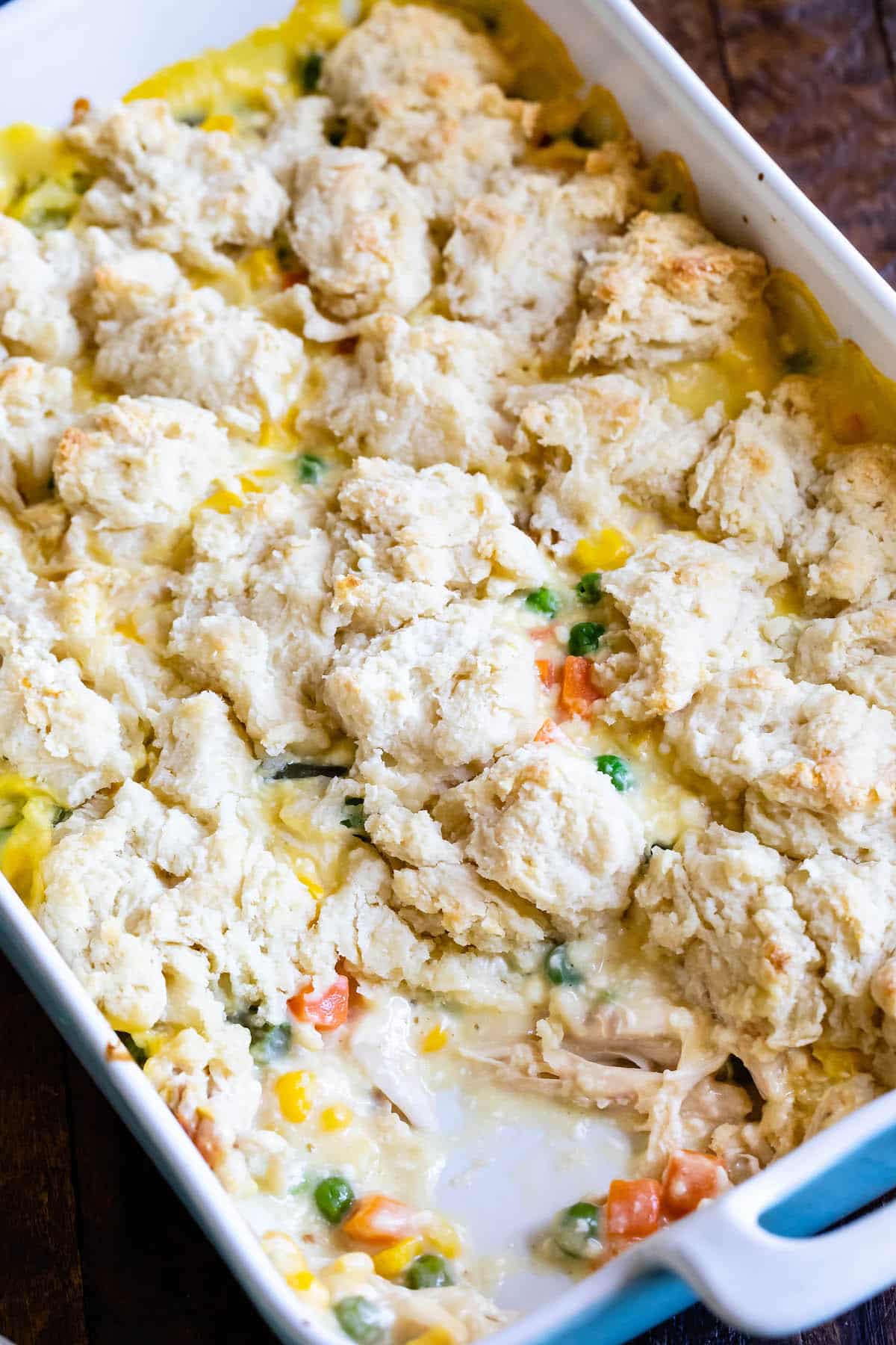 chicken and biscuits cooked together in a white pan