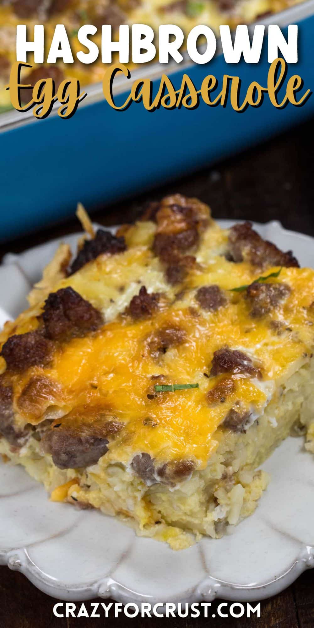 piece of egg casserole on a grey plate with words on top