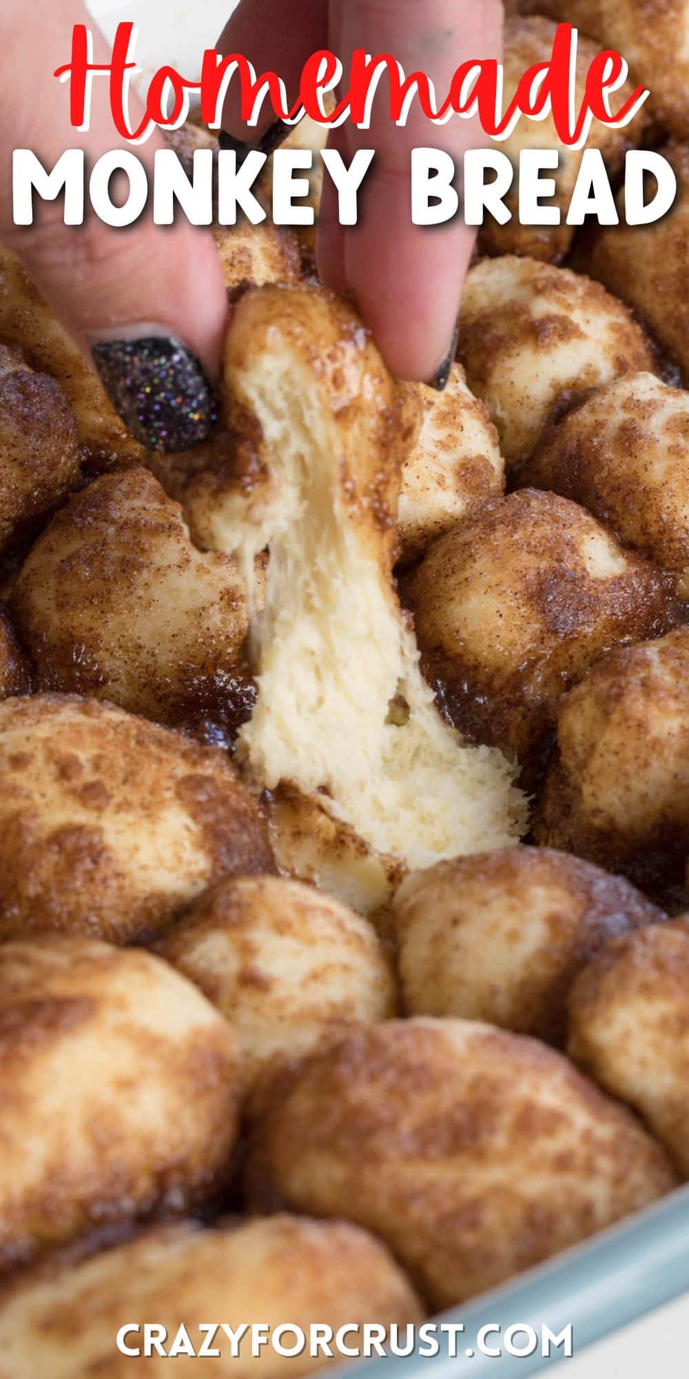 monkey bread baked in the pan with a hand pulling a piece out with words on the photo