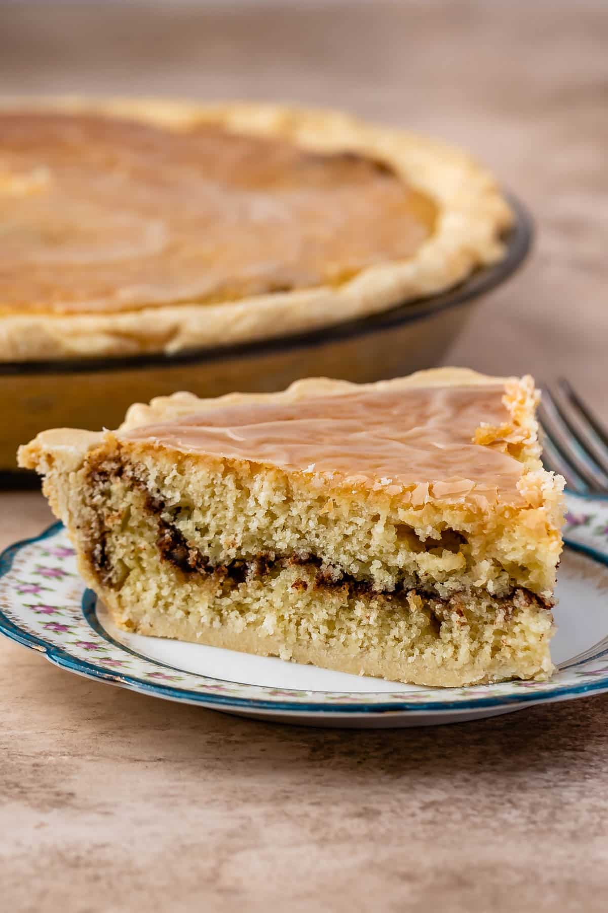 one slice of snickerdoodle pie on a white plate