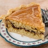 one slice of snickerdoodle pie on a white plate