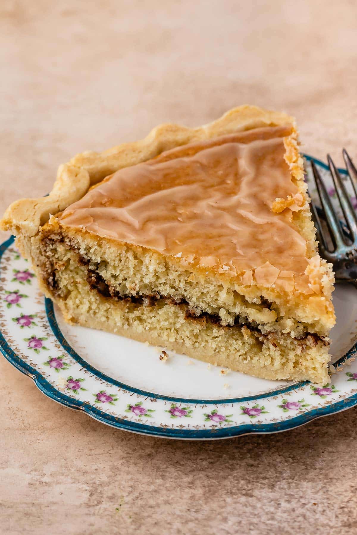 one slice of snickerdoodle pie on a white plate