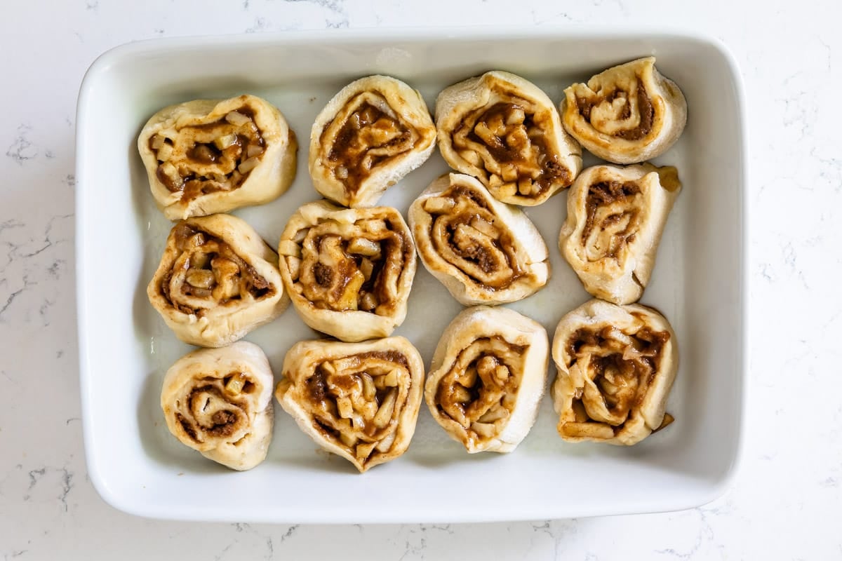 cut cinnamon rolls in pan.