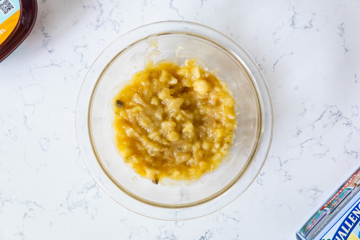 bowl of mashed bananas on counter.