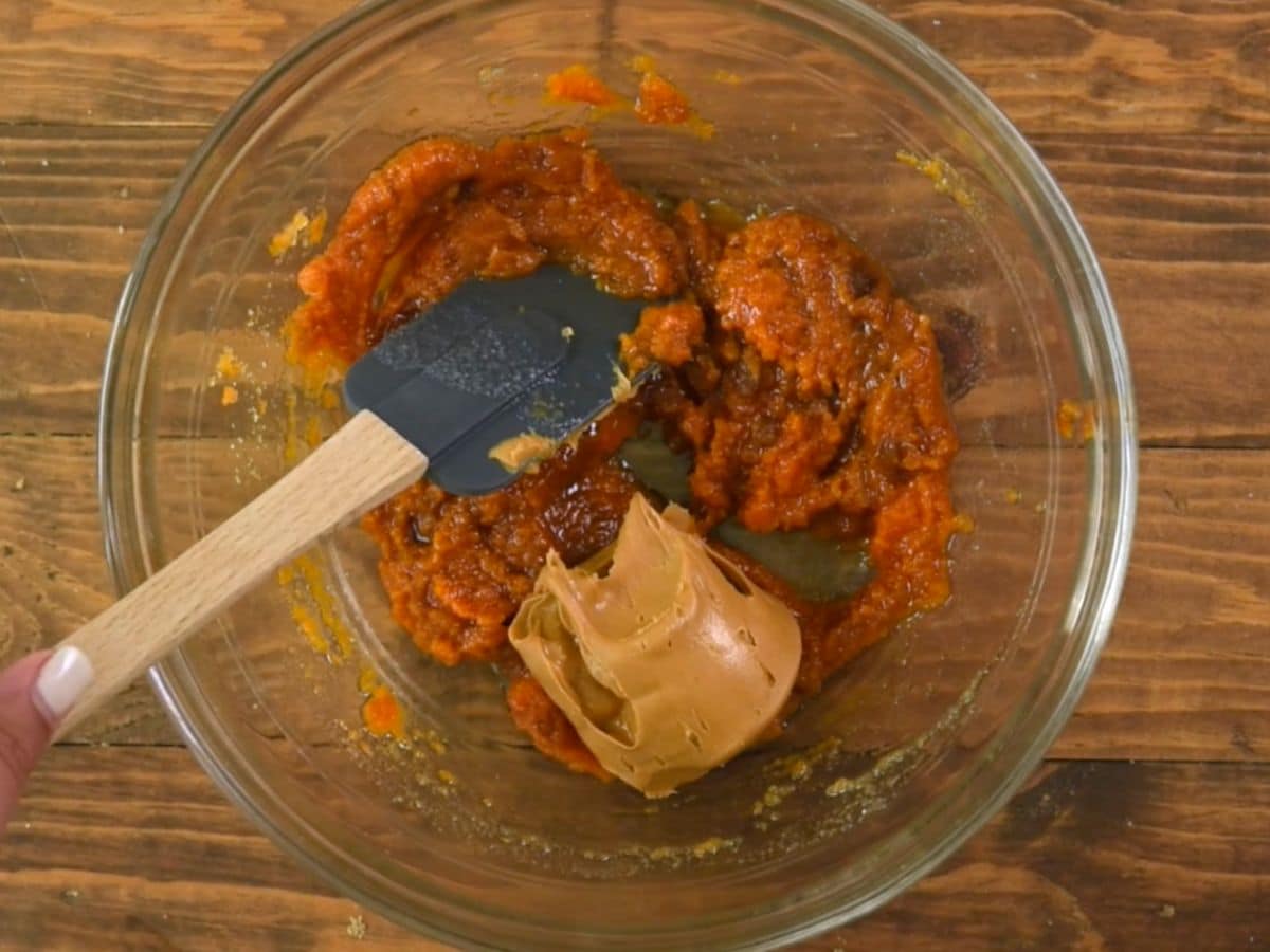 pumpkin bread batter in bowl with peanut butter.