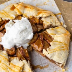 circular pear pastry dessert on parchment paper with ice cream on top