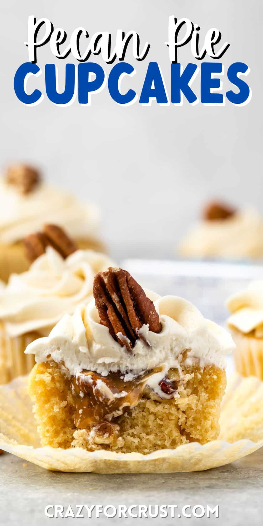 pecan pie cupcakes cut in half with white frosting and a pecan on top with words on the image
