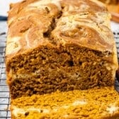 loaf on a drying rack with one slice take from it and laying in front