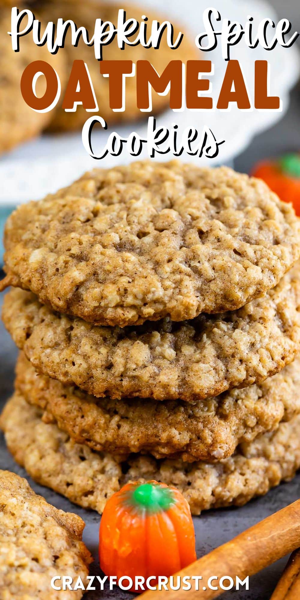 stacked oatmeal cookies next to cinnamon sticks and candy corn pumpkins with words on top