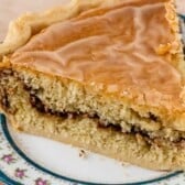 one slice of snickerdoodle pie on a white plate with words on top