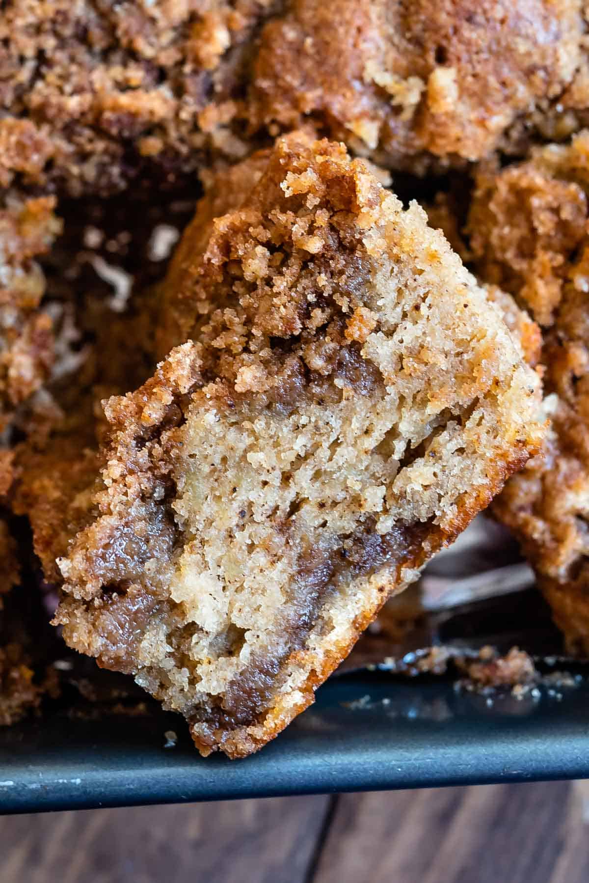 crumb cake laid on its side around other pieces of the crumb cake