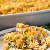 pasta and breadcrumbs and vegetables mixed together on a white plate