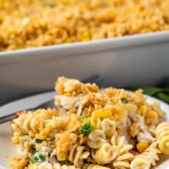 pasta and breadcrumbs and vegetables mixed together on a white plate