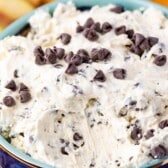 cookie dough in a dark blue bowl with words on top