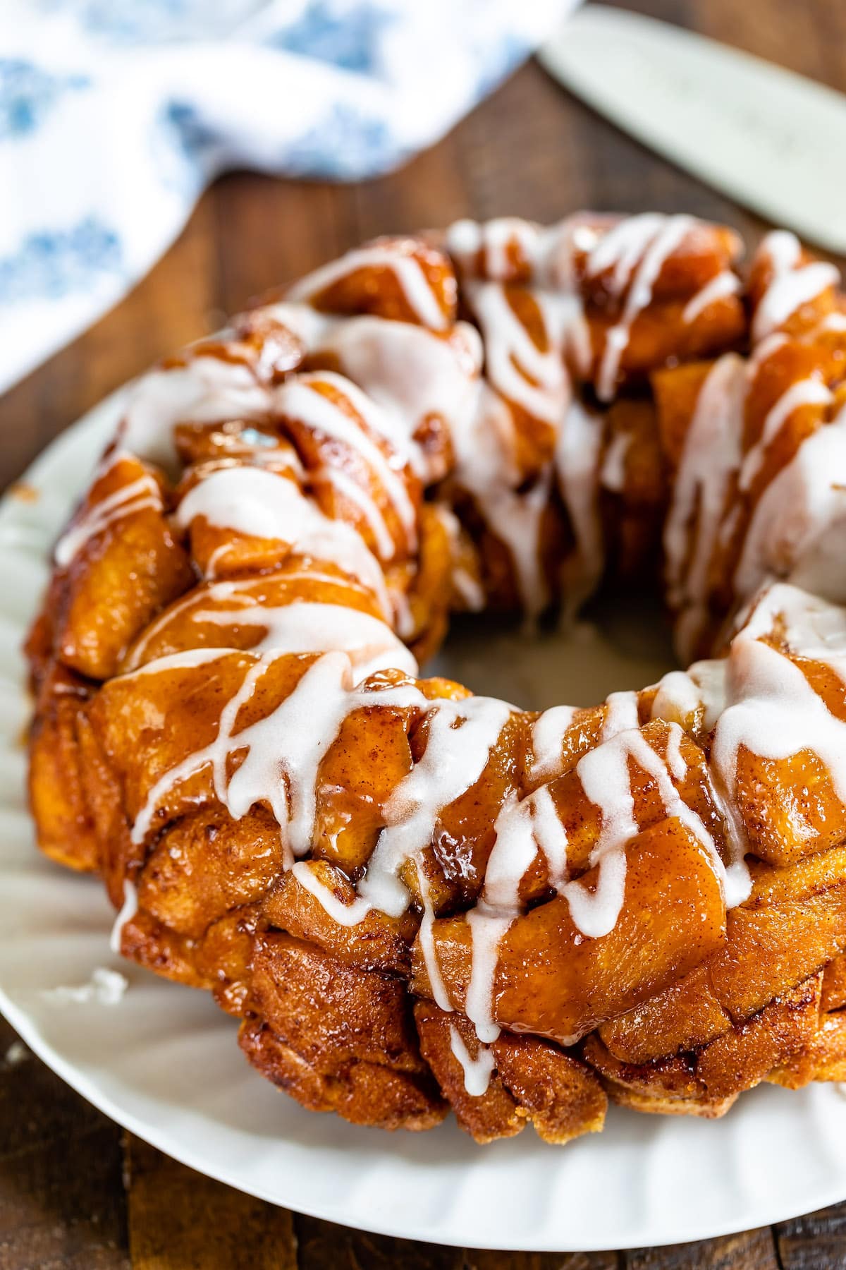 monkey bread with glaze on white plate