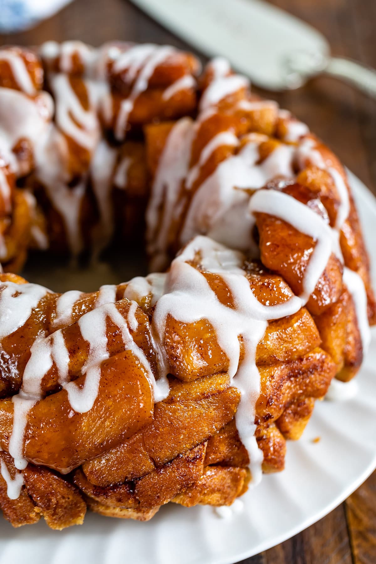 monkey bread with glaze on white plate