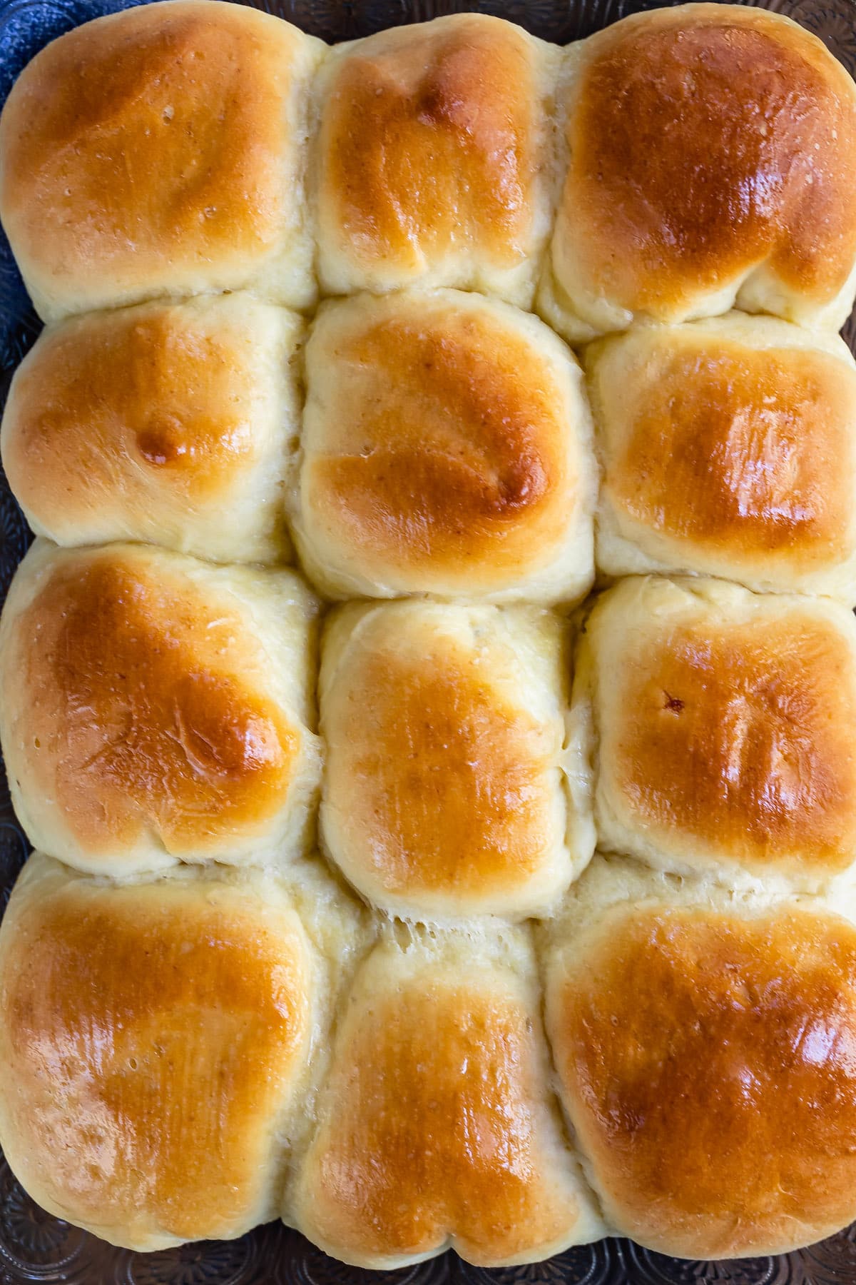 a potato roll stacked on other potato rolls