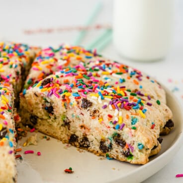 scones with sprinkles and chocolate baked in on a tan plate