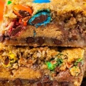 stacked gooey bars with M&Ms baked in with words on top